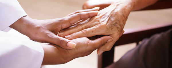 doctor holding patient hands