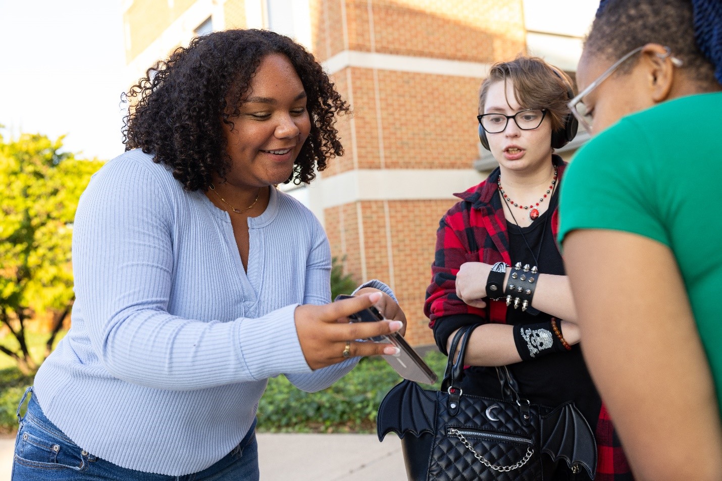 teens looking at cell phone