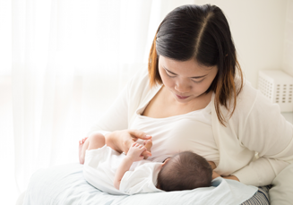 woman breastfeeding her baby