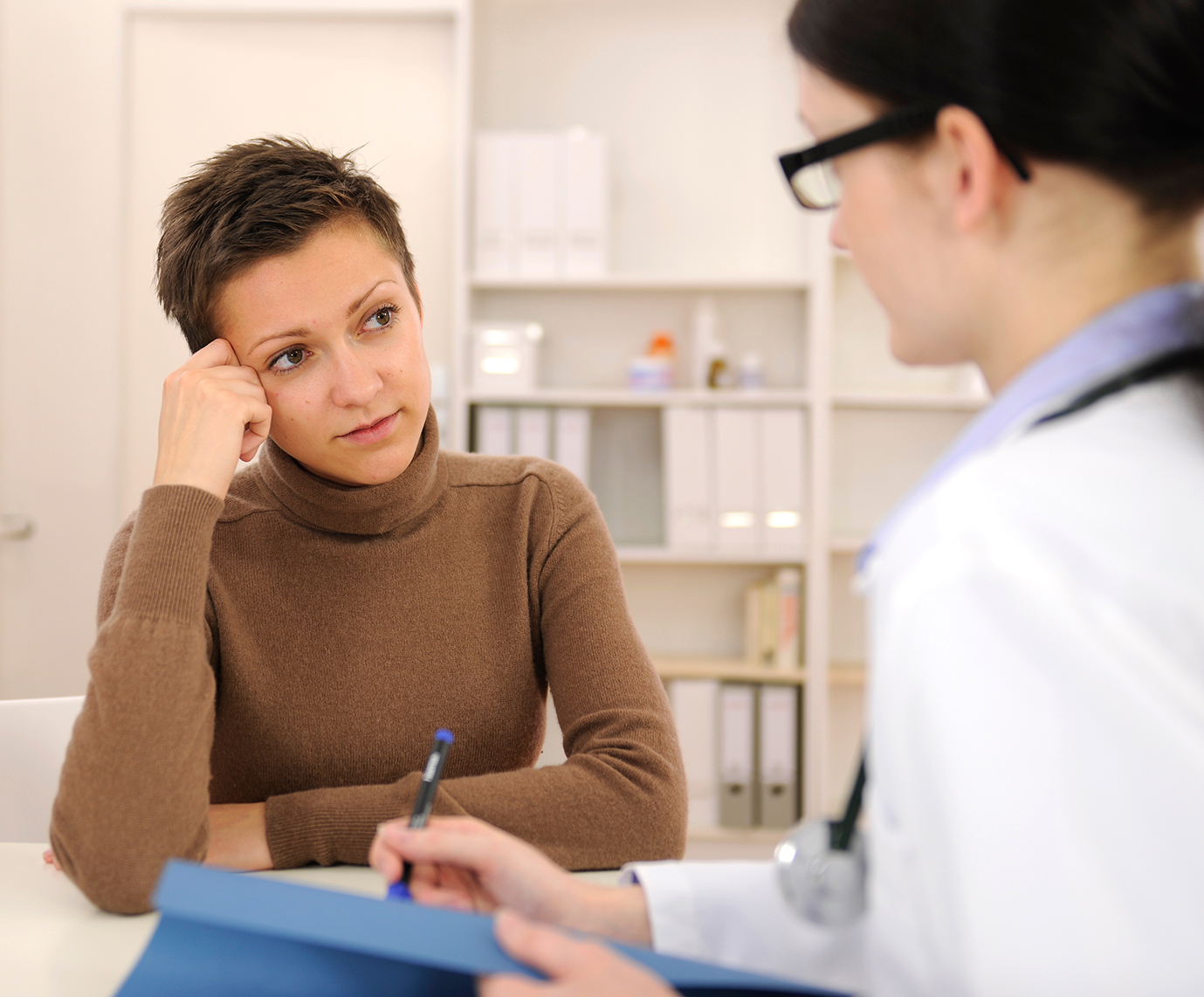 Woman consulting with her physician.